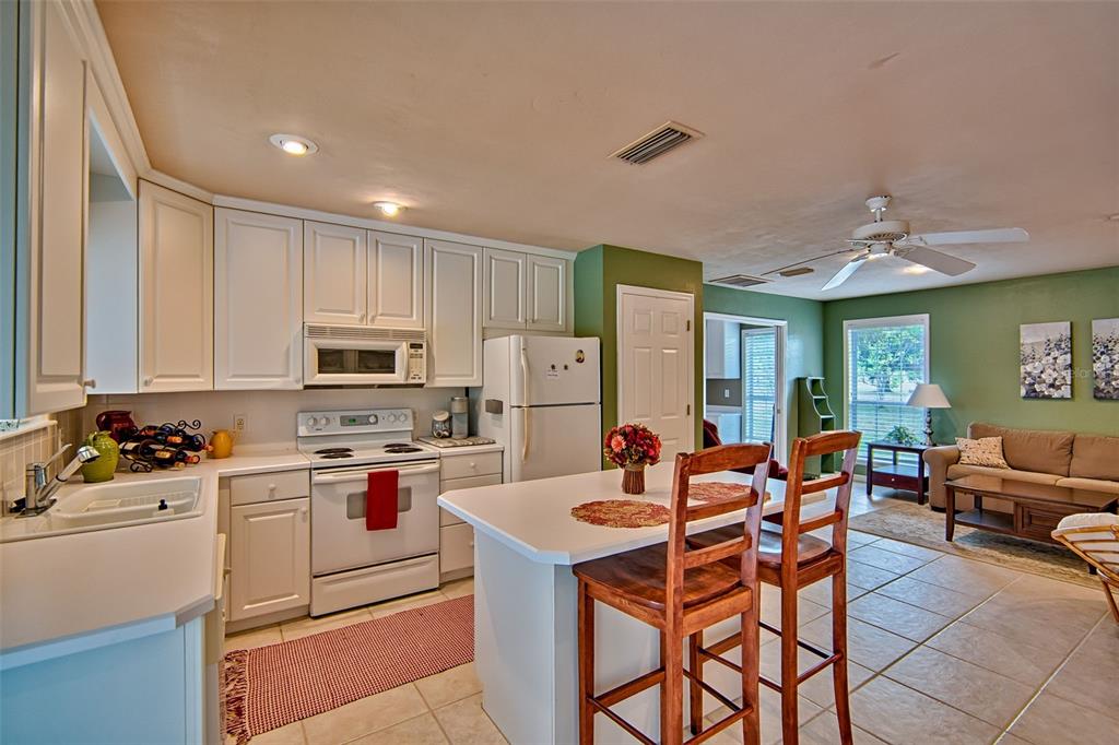 10912 Southwest 17 Lane Gainesville, FL 32607 - Photo 43 of 67 a kitchen with stainless steel appliances a stove a sink dishwasher and a refrigerator