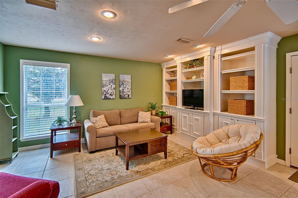 10912 Southwest 17 Lane Gainesville, FL 32607 - Photo 44 of 67 a living room with furniture and a window