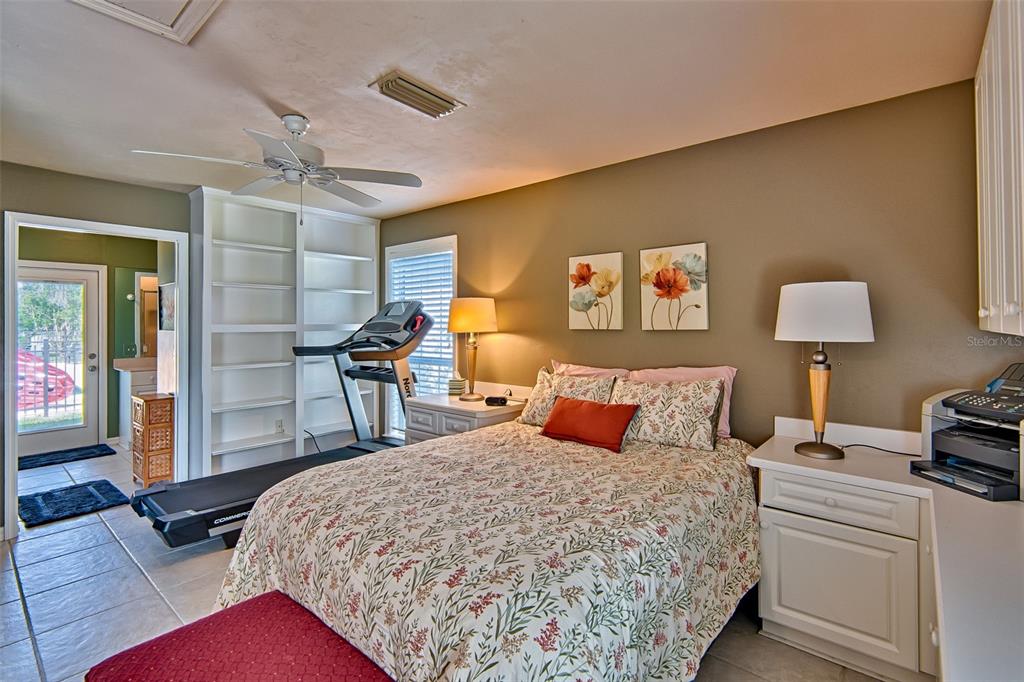 10912 Southwest 17 Lane Gainesville, FL 32607 - Photo 46 of 67 a bedroom with a bed and wooden floor