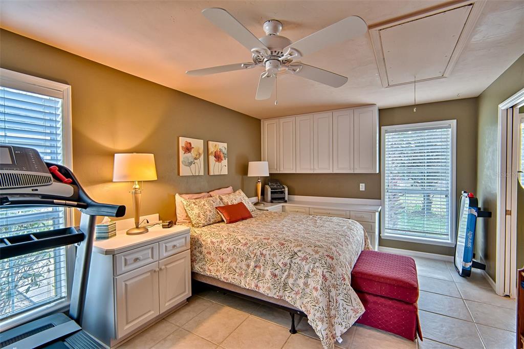 10912 Southwest 17 Lane Gainesville, FL 32607 - Photo 47 of 67 a bedroom with a bed and dresser