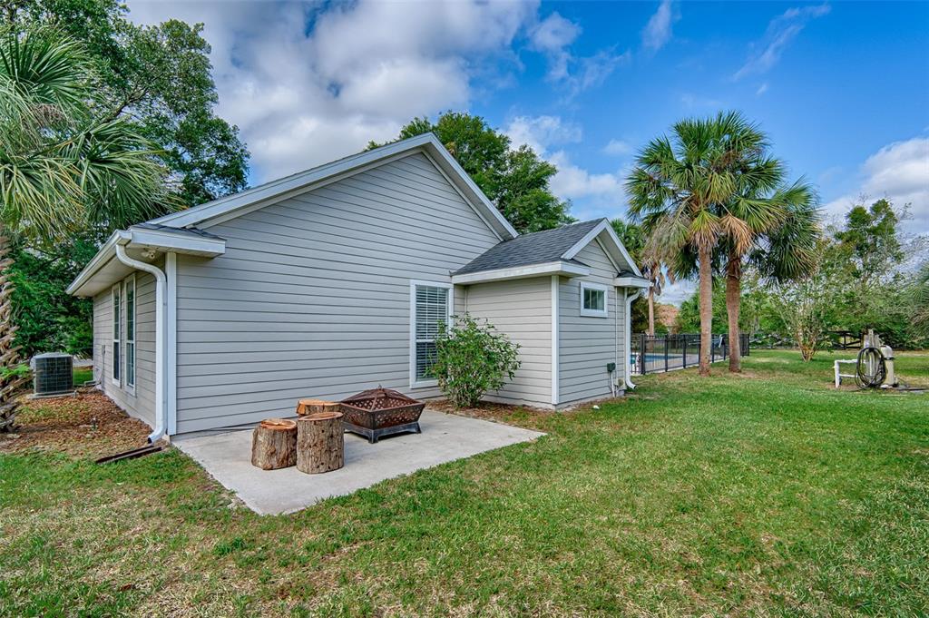 10912 Southwest 17 Lane Gainesville, FL 32607 - Photo 49 of 67 a view of a house with backyard and sitting area