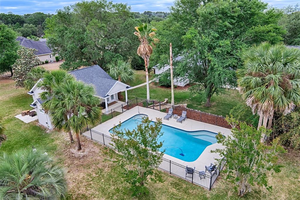 10912 Southwest 17 Lane Gainesville, FL 32607 - Photo 60 of 67 an aerial view of a house with garden space and street view