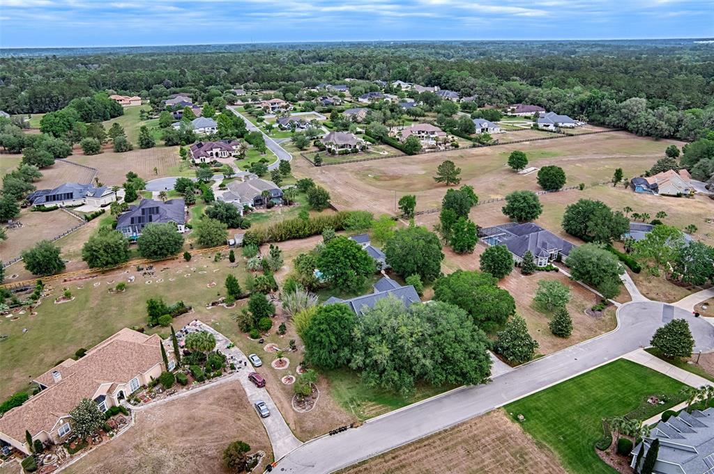 10912 Southwest 17 Lane Gainesville, FL 32607 - Photo 62 of 67 an aerial view of residential houses with outdoor space