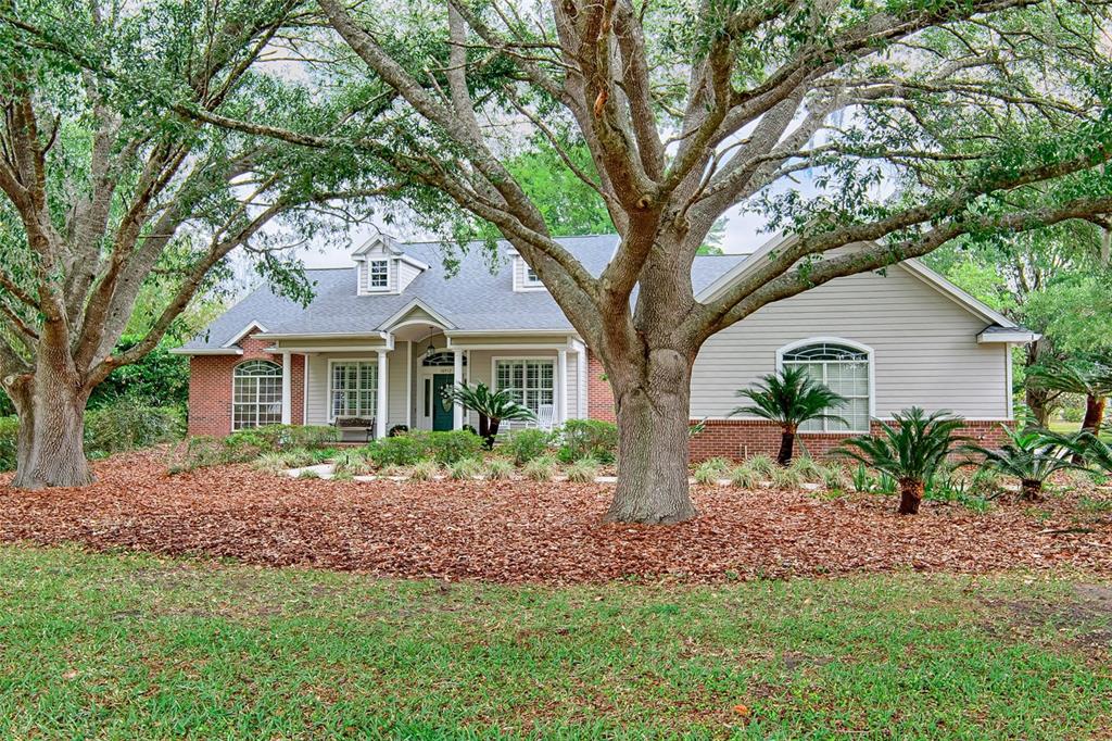 10912 Southwest 17 Lane Gainesville, FL 32607 - Photo 64 of 67 a front view of a house with garden