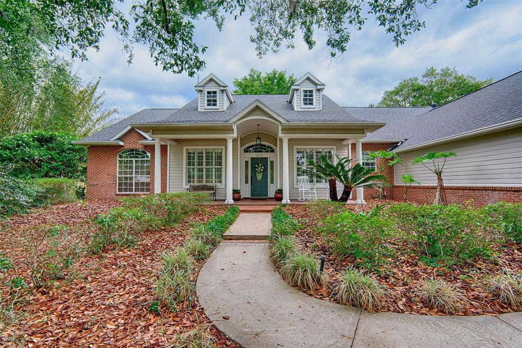 10912 Southwest 17 Lane Gainesville, FL 32607 - Photo 66 of 67 front view of a house with a yard