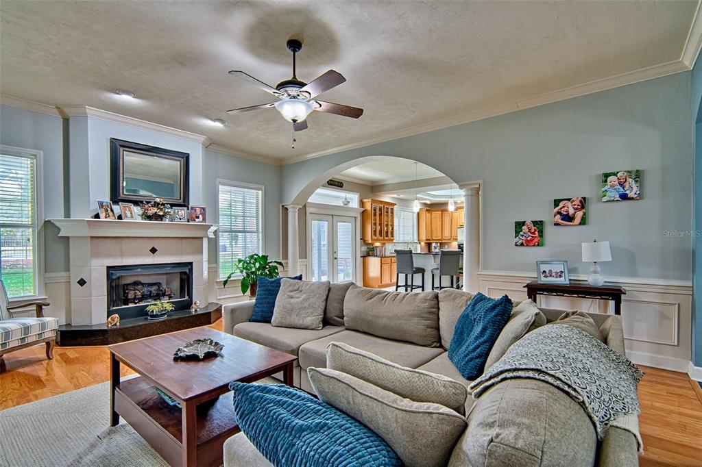 10912 Southwest 17 Lane Gainesville, FL 32607 - Photo 10 of 67 a living room with furniture a fireplace and a flat screen tv