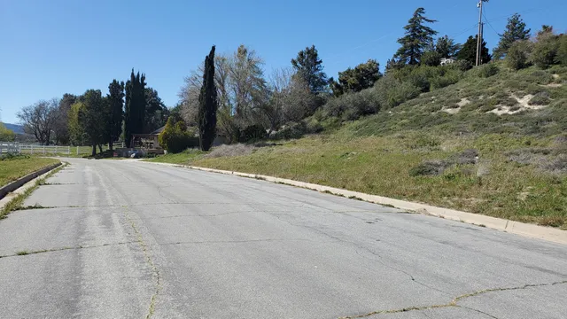 a view of a road with a yard