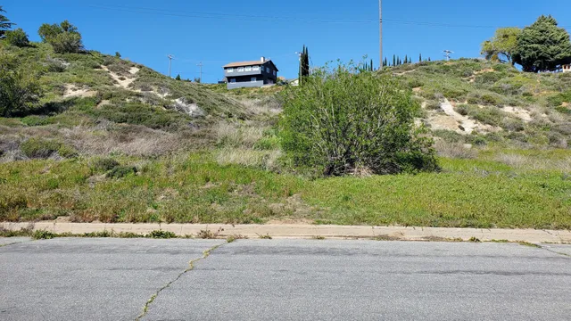 a view of a backyard of the house