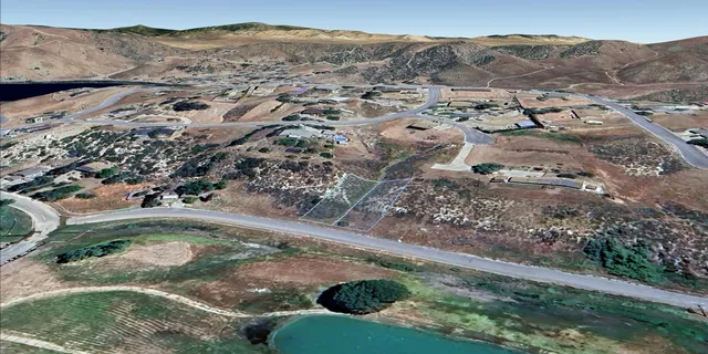 a view of a town with mountains