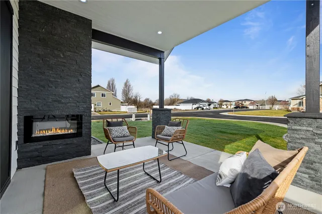 a balcony with furniture and a garden