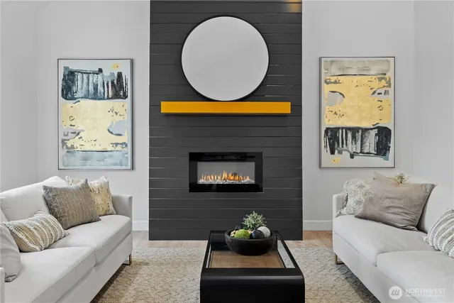 a living room with furniture a wall paintings a wall and a painting