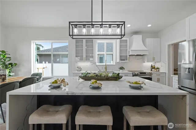 a kitchen with a table and chairs in it