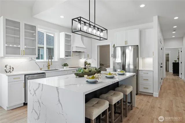 a kitchen with a sink stove and refrigerator