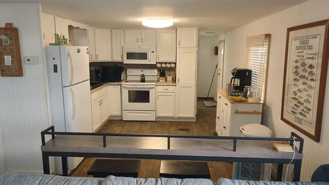 a kitchen with stainless steel appliances a refrigerator and stove