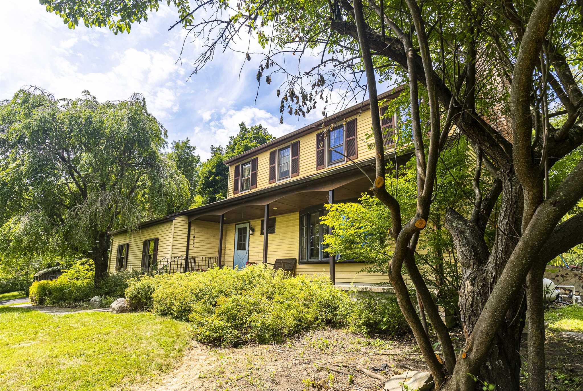 7 Kerr Road Rhinebeck, NY 12572 - Photo 2 of 21 a front view of a house with a yard and large trees