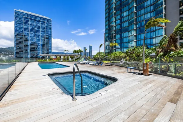 a swimming pool with view of tall buildings