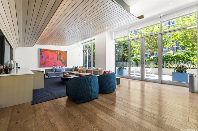 a living room with furniture large window and flat screen tv