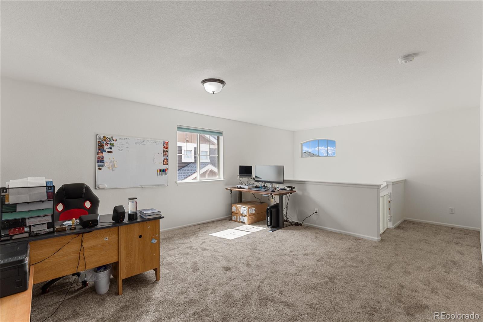 1074 Acadia Circle Erie, CO 80516 - Photo 14 of 50 a living room with furniture and a dining table