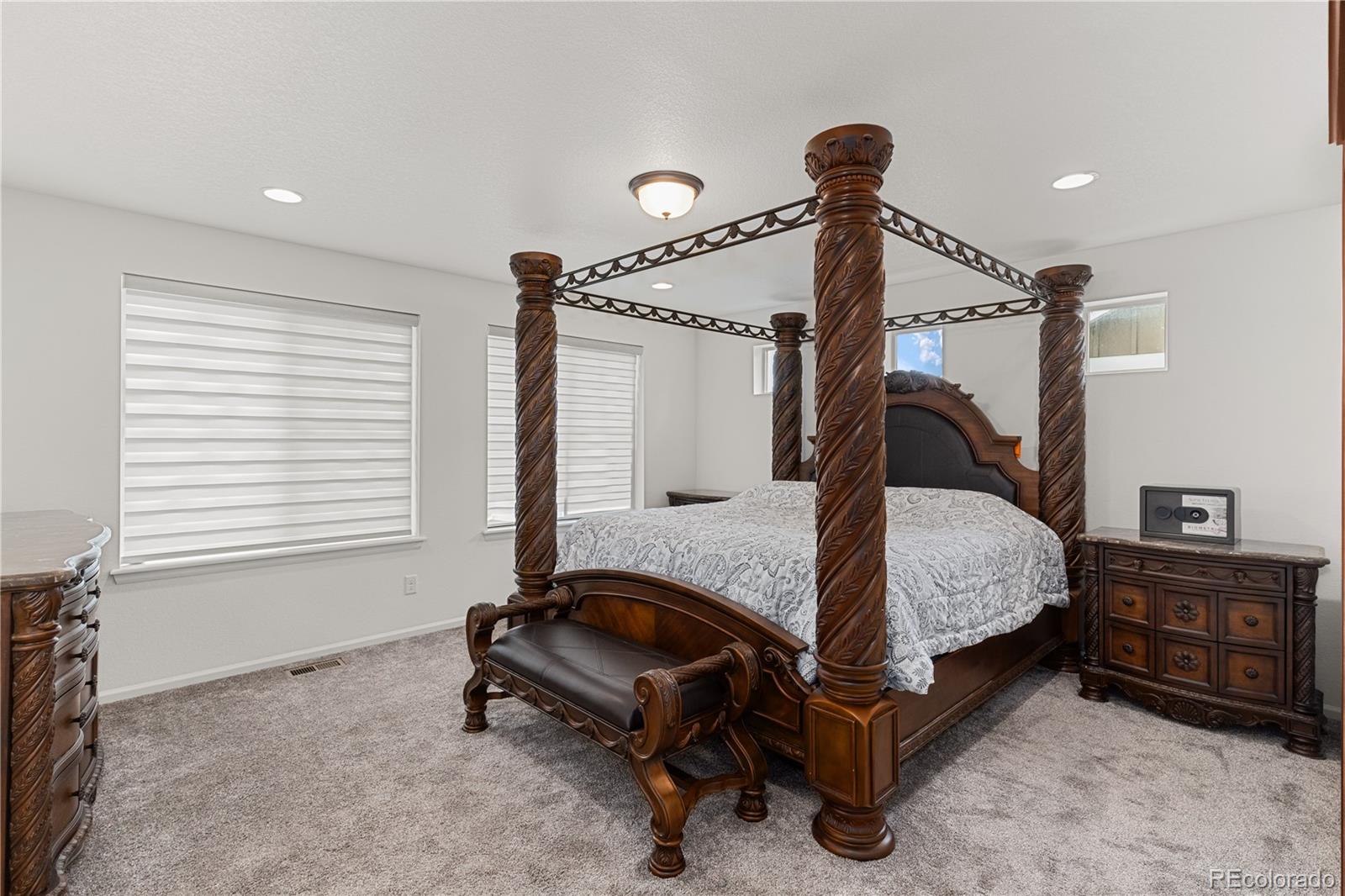 1074 Acadia Circle Erie, CO 80516 - Photo 18 of 50 a bedroom with a bed a window and dresser