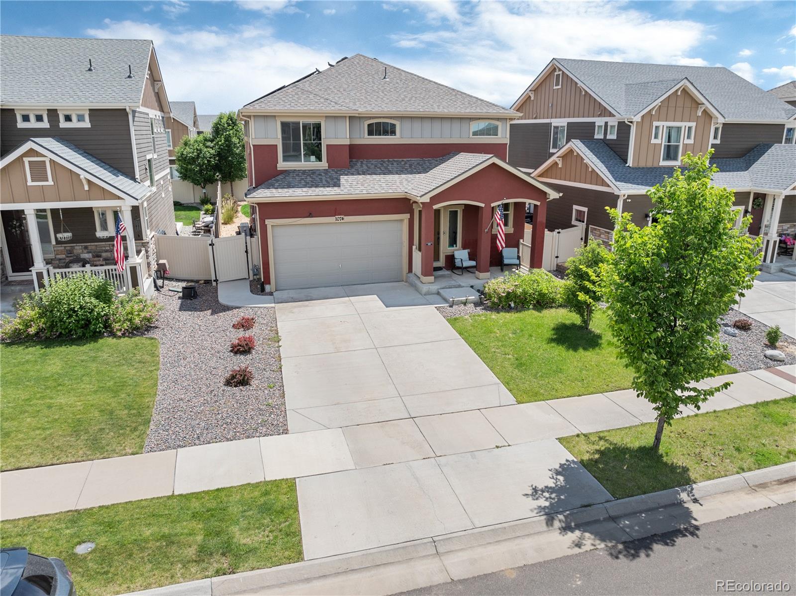 1074 Acadia Circle Erie, CO 80516 - Photo 2 of 50 front view of house with a yard