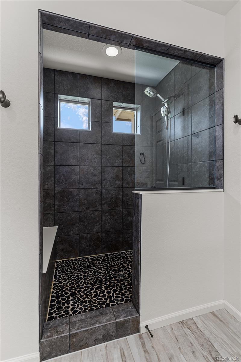 1074 Acadia Circle Erie, CO 80516 - Photo 22 of 50 a bathroom with a shower
