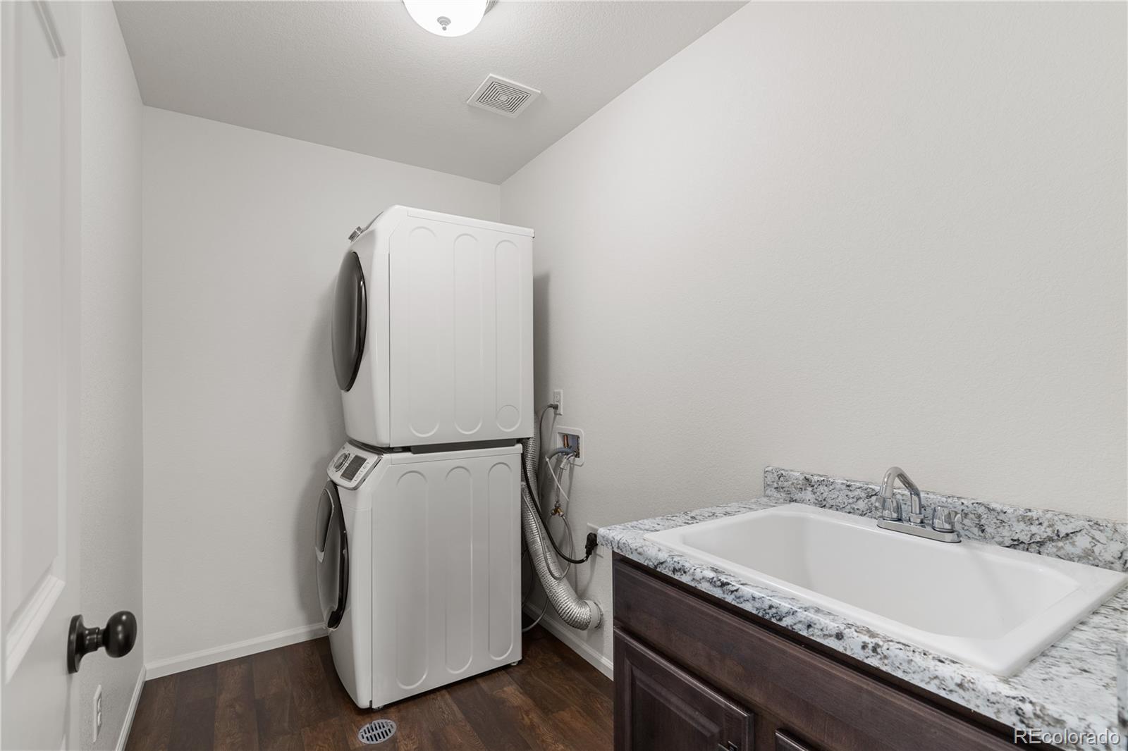 1074 Acadia Circle Erie, CO 80516 - Photo 23 of 50 a bathroom with a granite countertop sink and a tub