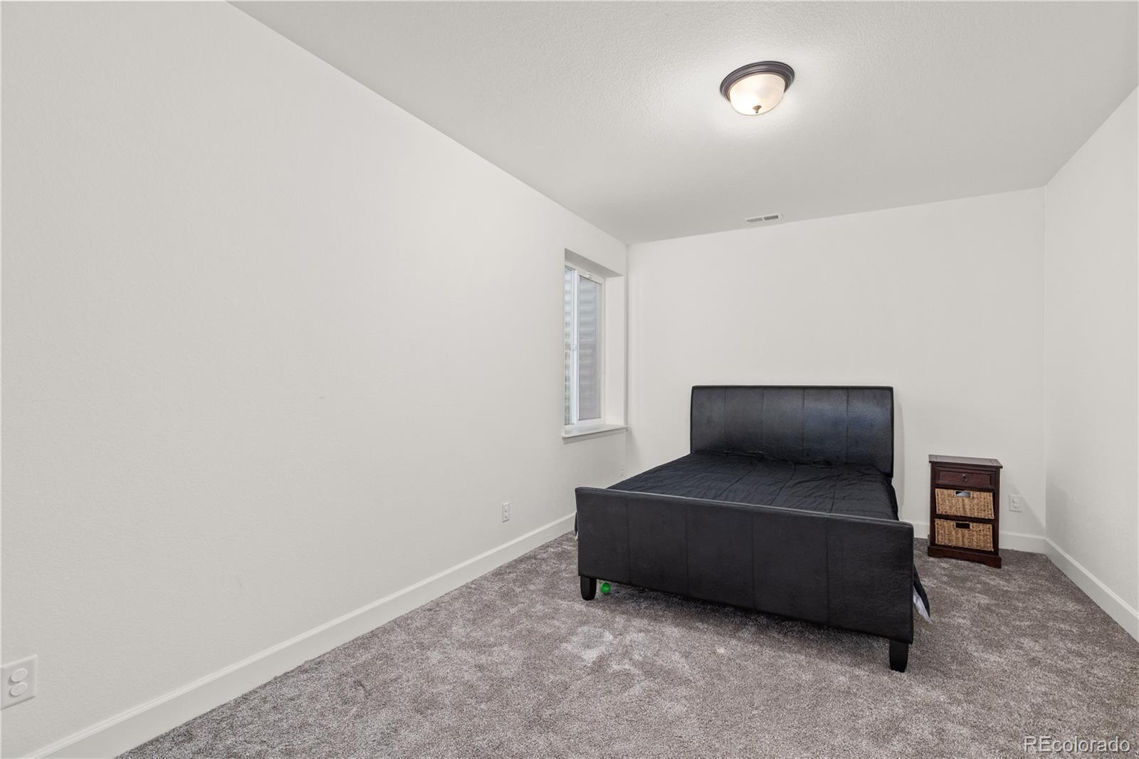1074 Acadia Circle Erie, CO 80516 - Photo 27 of 50 a living room with furniture and a air conditioner vent