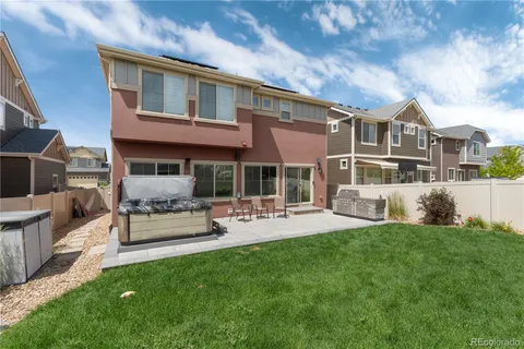 an aerial view of a house with a garden and plants