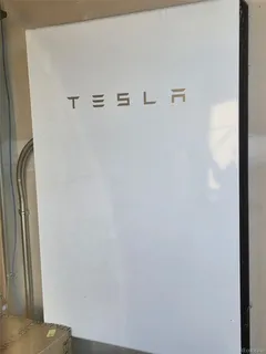 an aerial view of residential house with outdoor space and parking