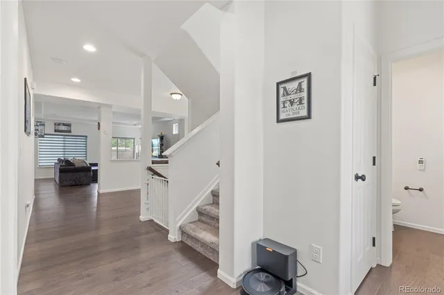 a view of living room and workspace