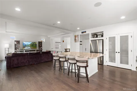 a living room with furniture window and wooden floor
