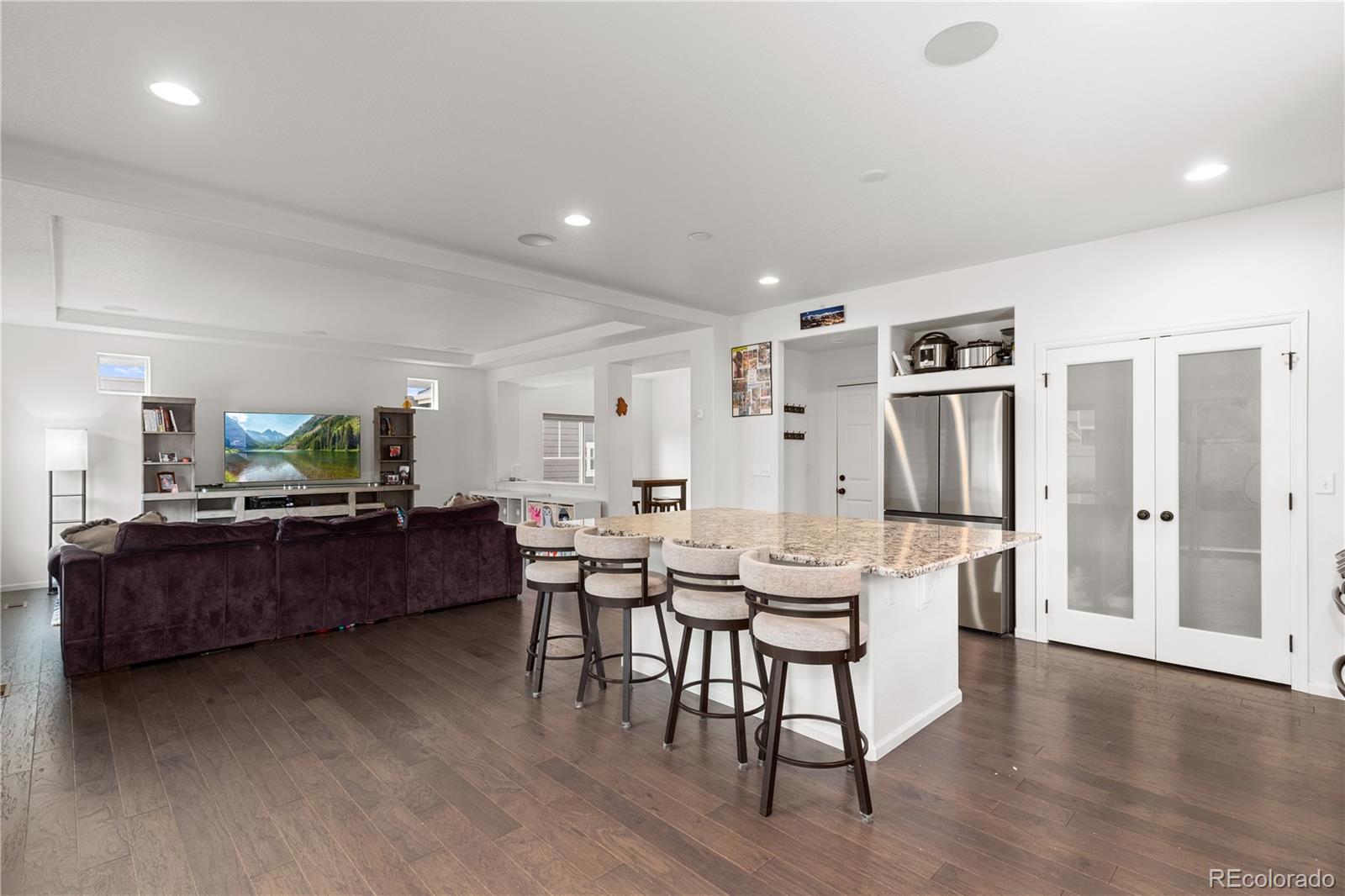 1074 Acadia Circle Erie, CO 80516 - Photo 6 of 50 a living room with furniture window and wooden floor