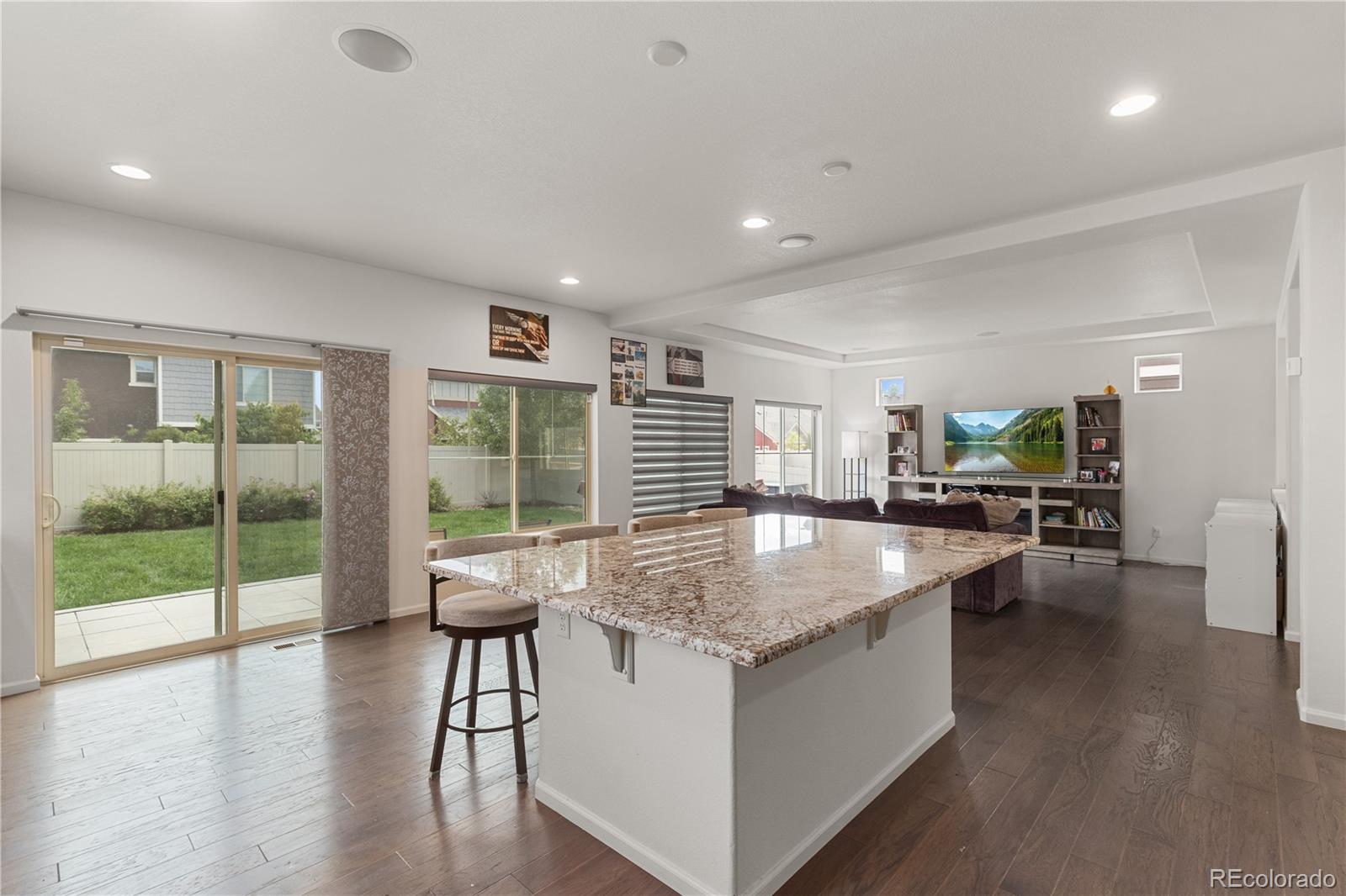 1074 Acadia Circle Erie, CO 80516 - Photo 7 of 50 a dining hall with stainless steel appliances granite countertop a granite counter tops and a large window