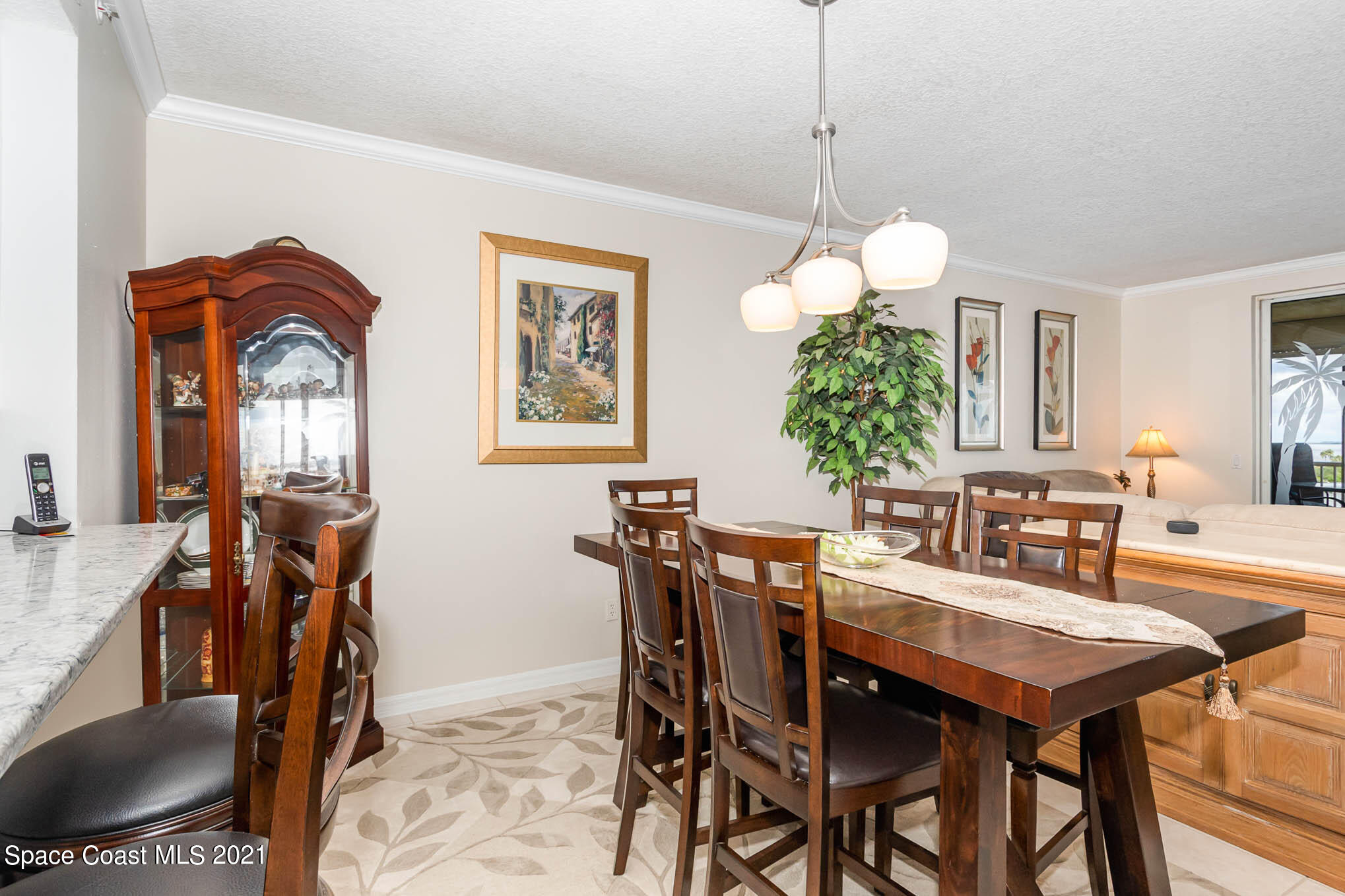 100 Riverside Drive, Unit 705 Cocoa, FL 32922 - Photo 13 of 39 a dining room with furniture and window