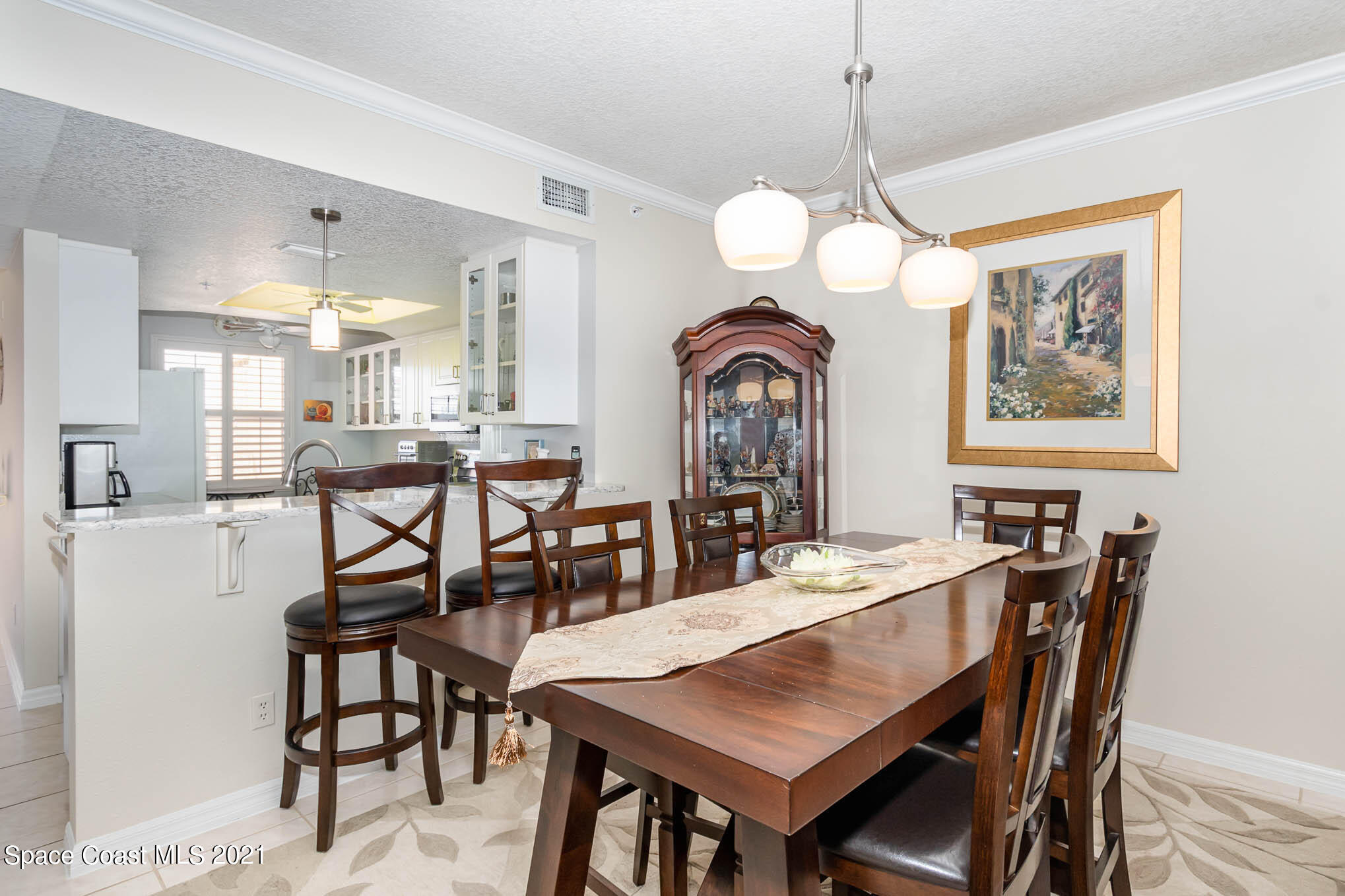 100 Riverside Drive, Unit 705 Cocoa, FL 32922 - Photo 14 of 39 a view of a a dining room with furniture window and wooden floor