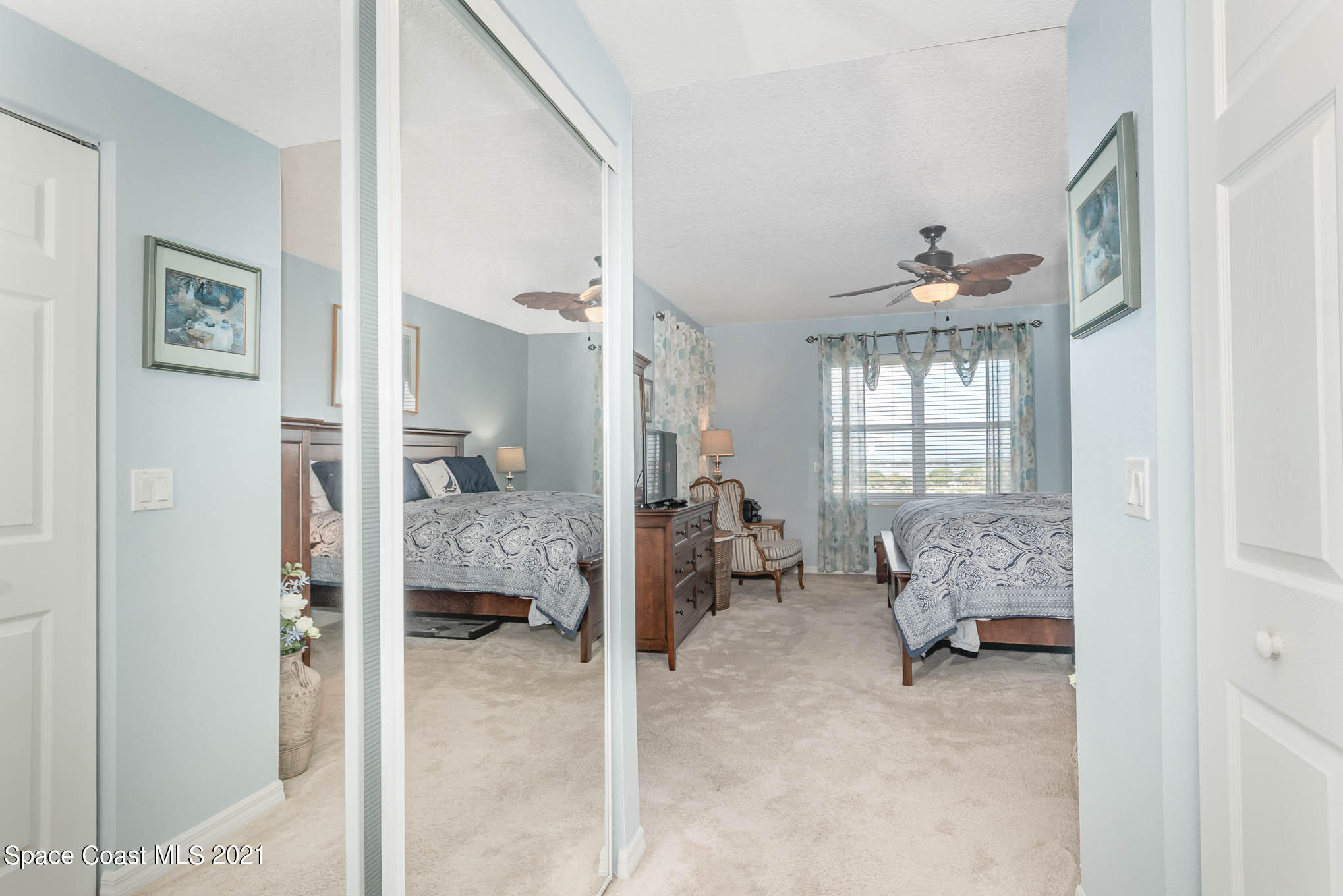 100 Riverside Drive, Unit 705 Cocoa, FL 32922 - Photo 20 of 39 a bedroom with furniture and a window