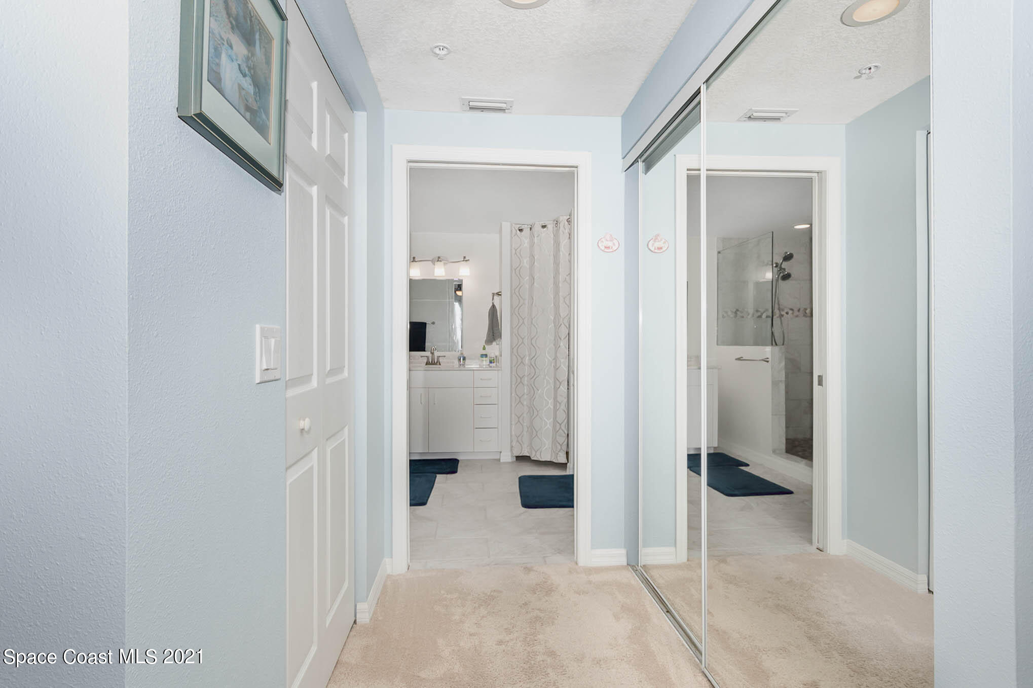100 Riverside Drive, Unit 705 Cocoa, FL 32922 - Photo 21 of 39 a view of a hallway with wooden shelves