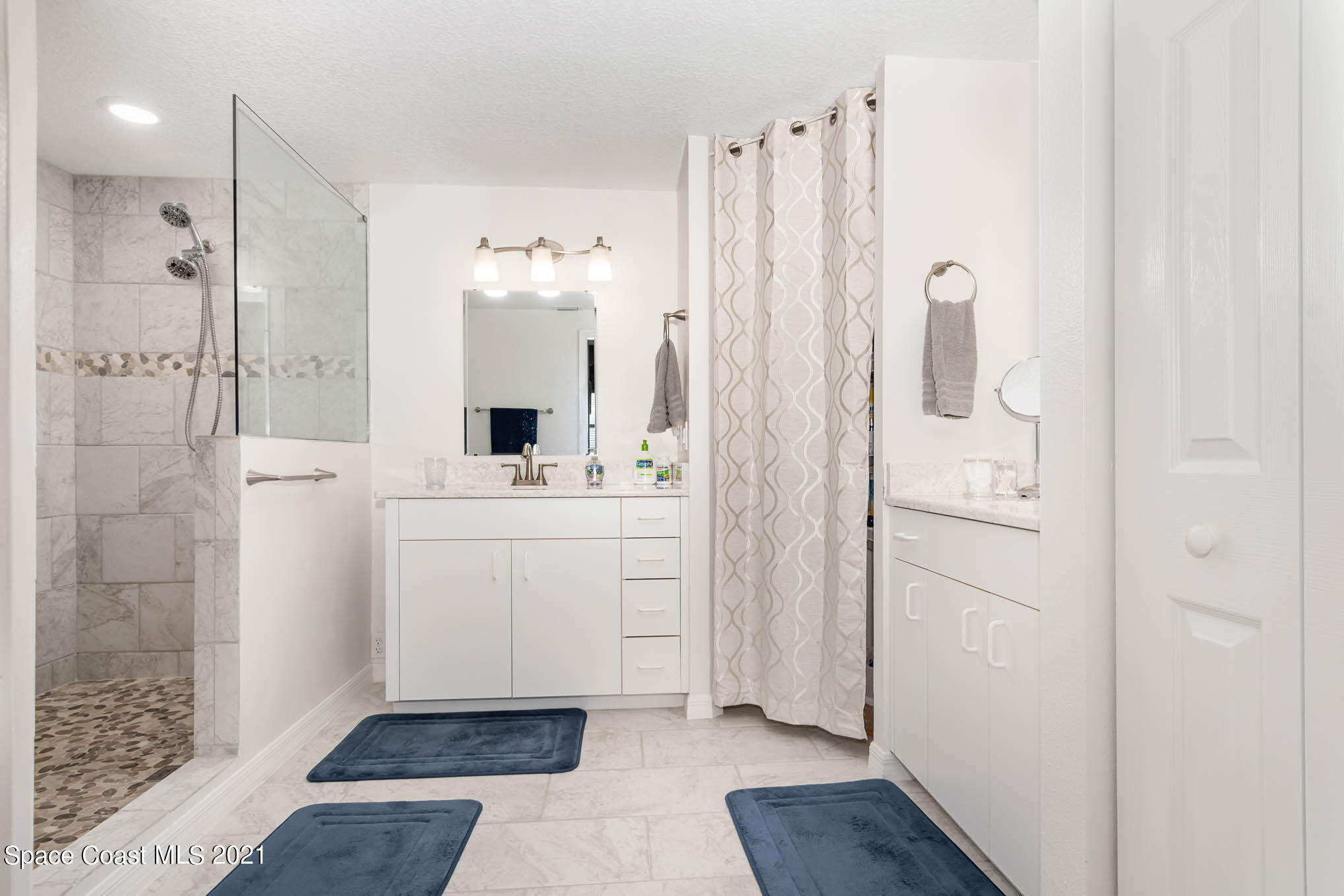 100 Riverside Drive, Unit 705 Cocoa, FL 32922 - Photo 23 of 39 a bathroom with a shower