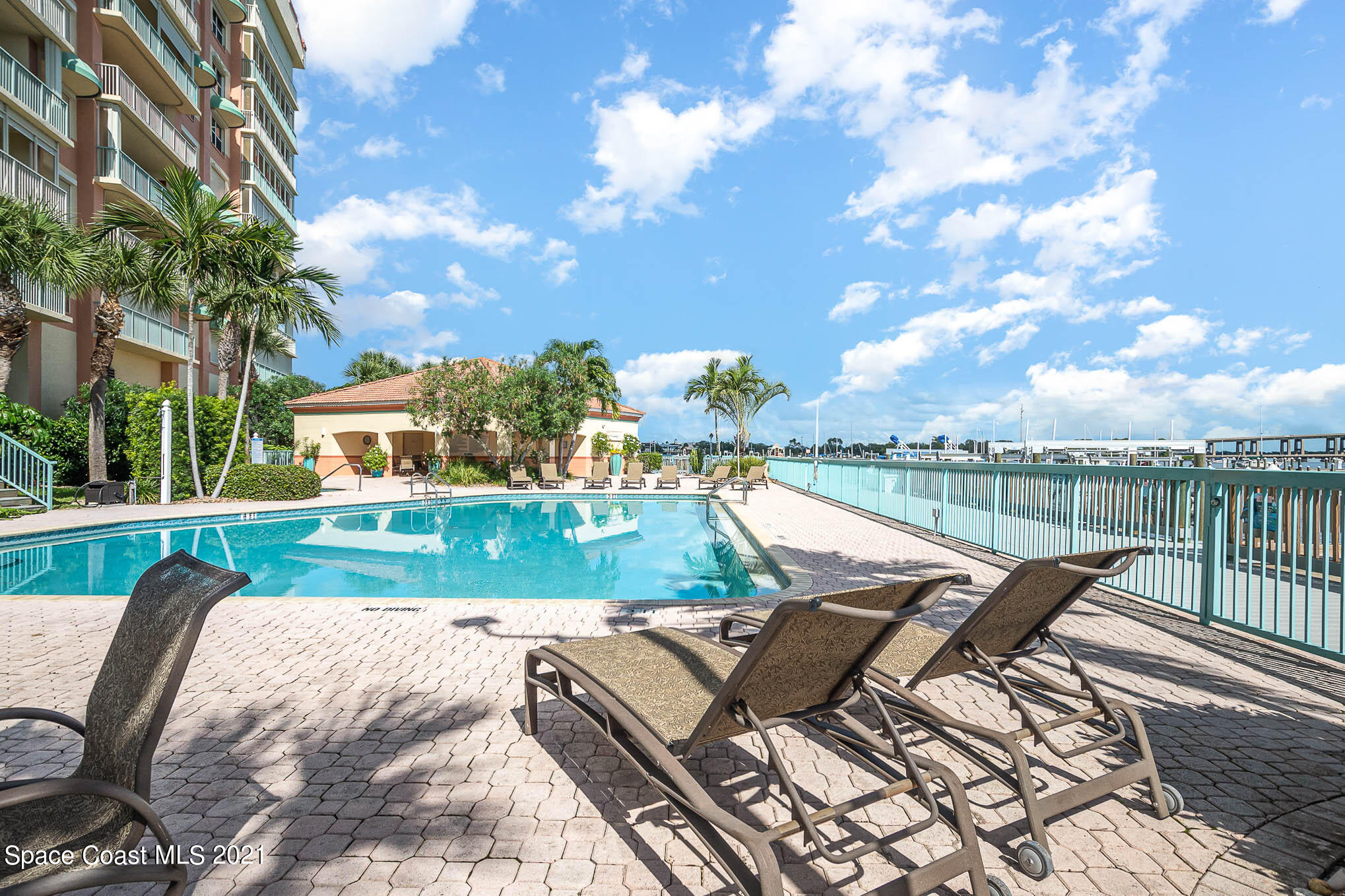 100 Riverside Drive, Unit 705 Cocoa, FL 32922 - Photo 32 of 39 a view of a patio with swimming pool