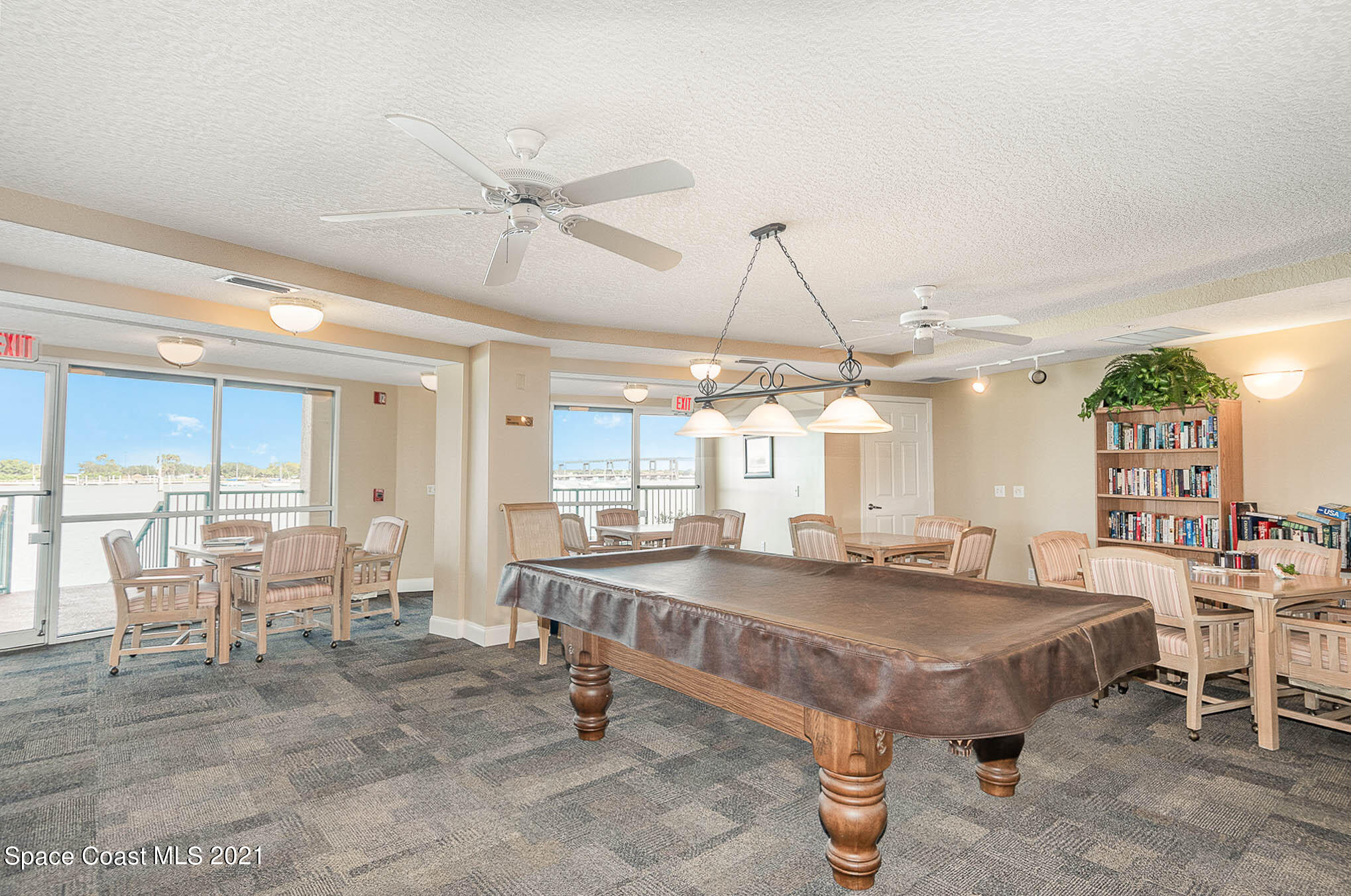100 Riverside Drive, Unit 705 Cocoa, FL 32922 - Photo 35 of 39 a room with lots of table chair