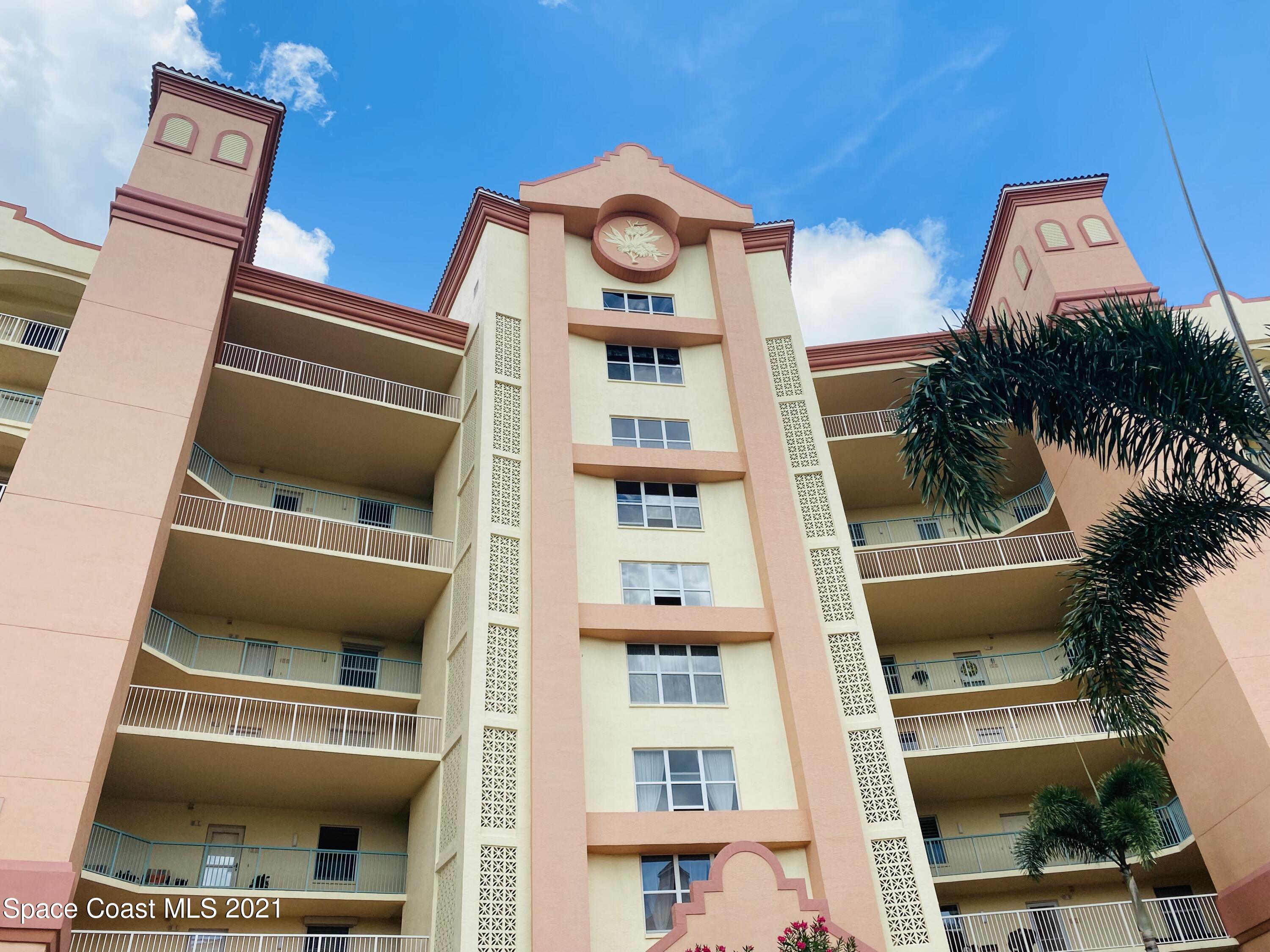 100 Riverside Drive, Unit 705 Cocoa, FL 32922 - Photo 4 of 39 a front view of a house with a balcony