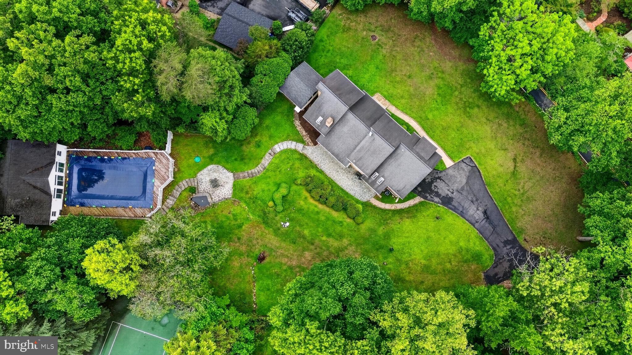 10320 Glen Road Potomac, MD 20854 - Photo 73 of 75 an aerial view of a house with a garden and trees
