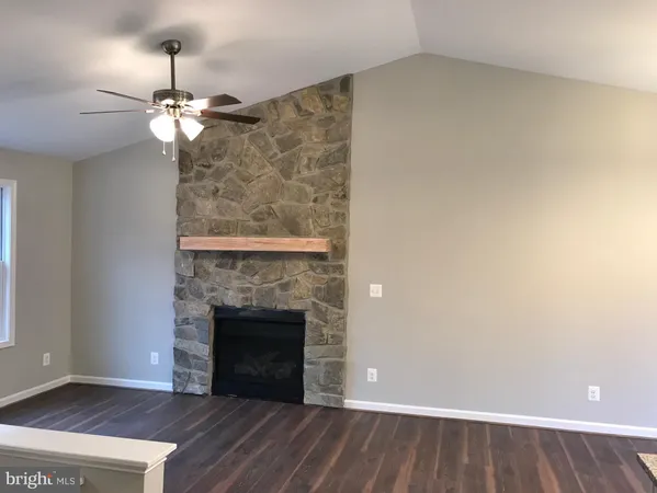 a view of a refrigerator in kitchen and wooden floor