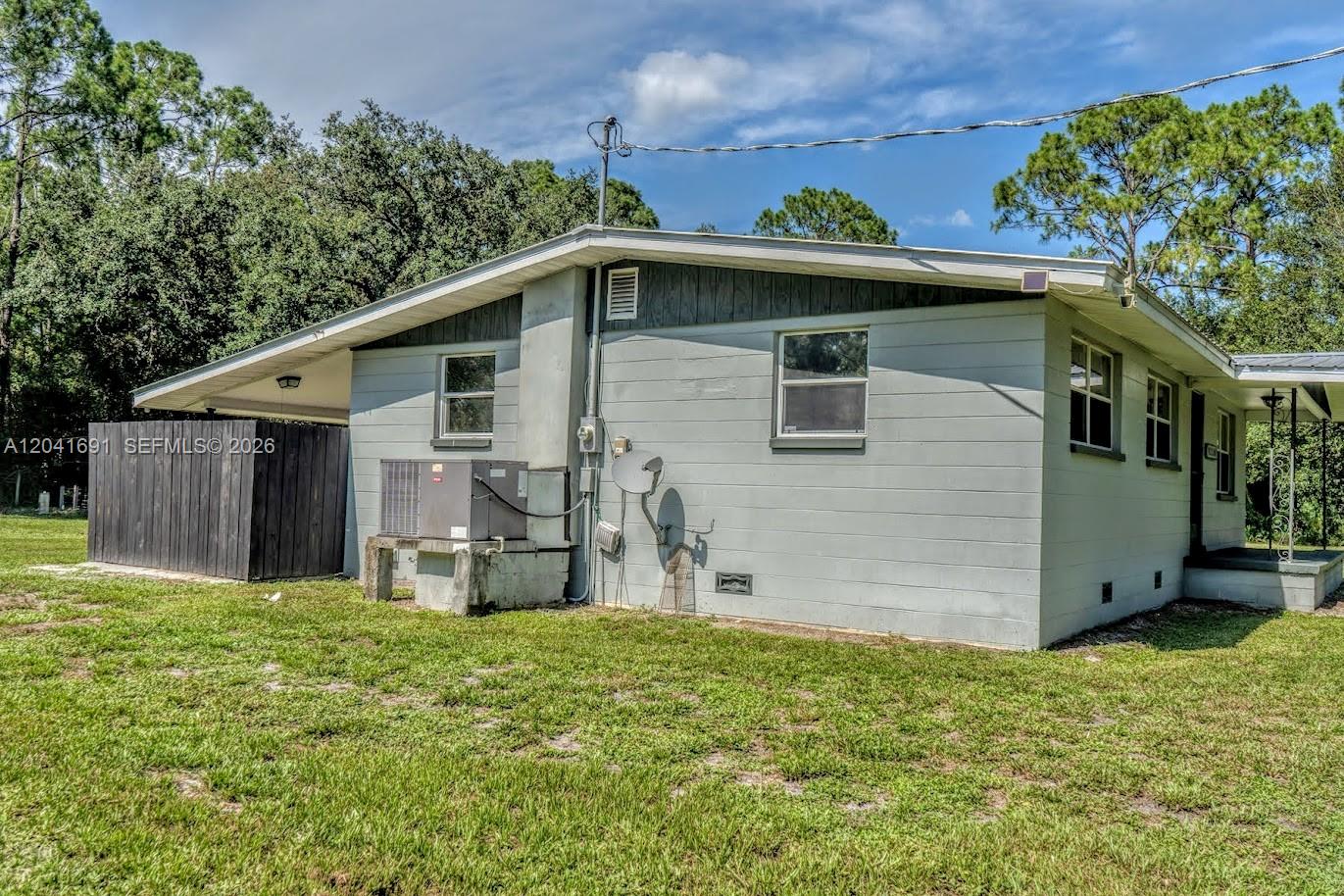 1270 Nobles Road LaBelle, FL 33935 - Photo 4 of 18 a view of a house with a yard