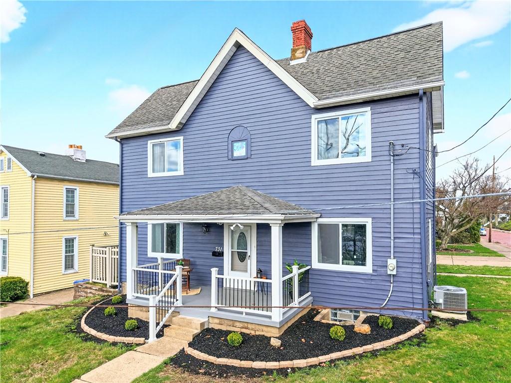 a front view of a house with yard outdoor seating and patio