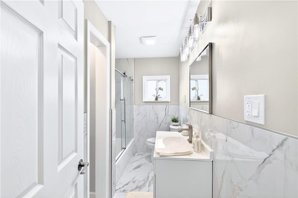 731 Chartiers Street Bridgeville, PA 15017 - Photo 20 of 48 a bathroom with a sink and a mirror