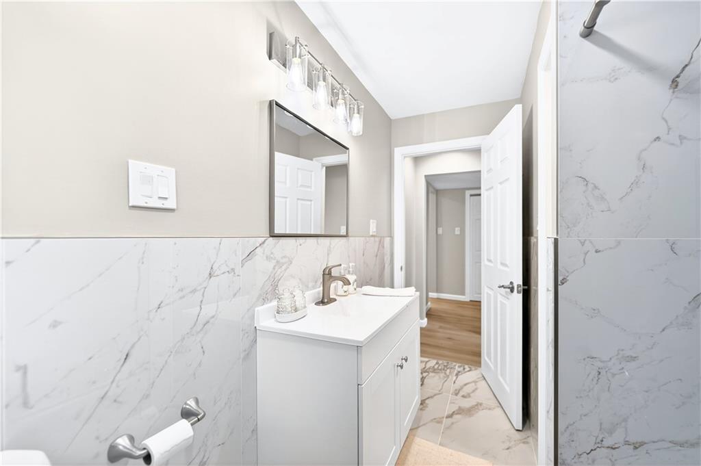 731 Chartiers Street Bridgeville, PA 15017 - Photo 22 of 48 a bathroom with a sink and a mirror