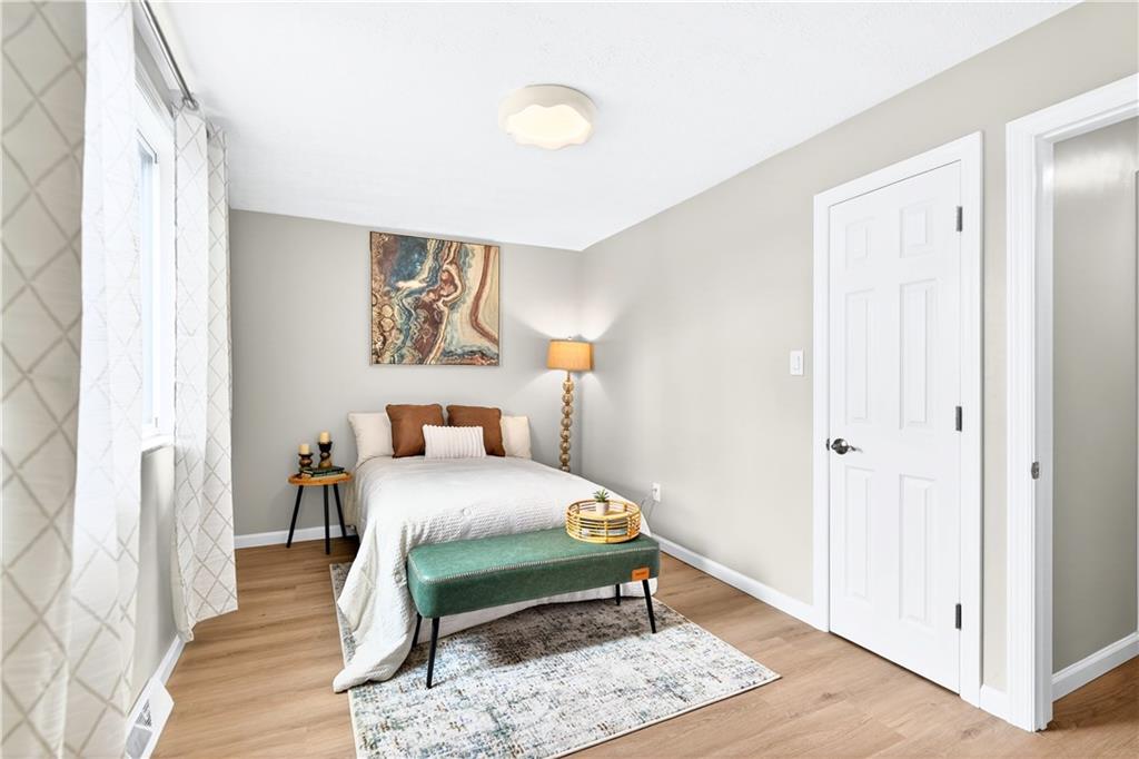 731 Chartiers Street Bridgeville, PA 15017 - Photo 23 of 48 a bedroom with a bed and a window with wooden floor