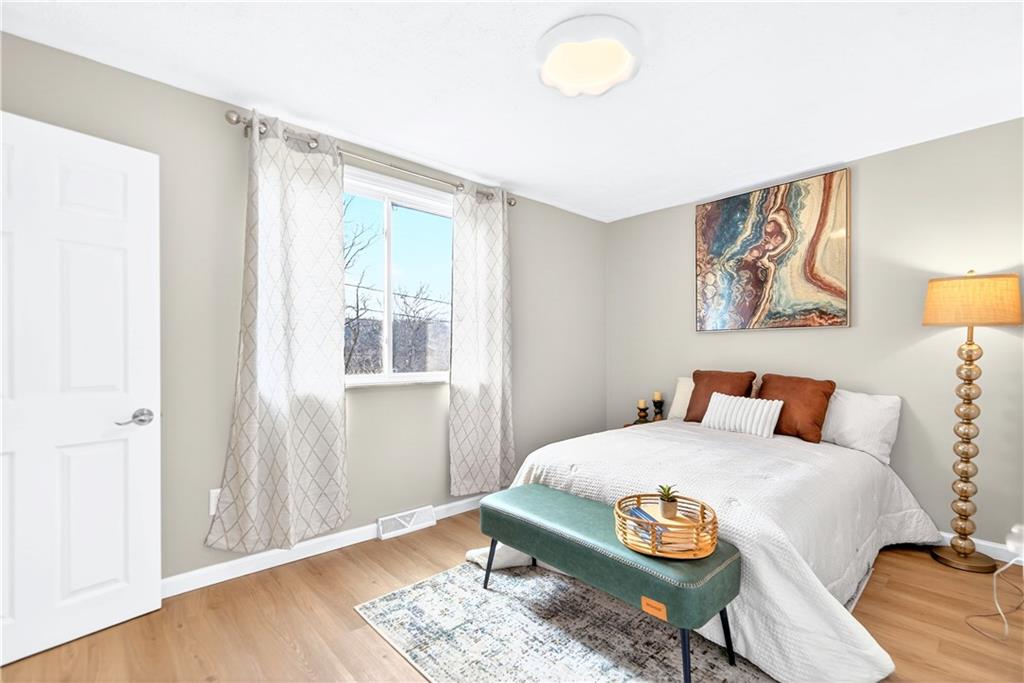 731 Chartiers Street Bridgeville, PA 15017 - Photo 24 of 48 a bedroom with a bed and wooden floor