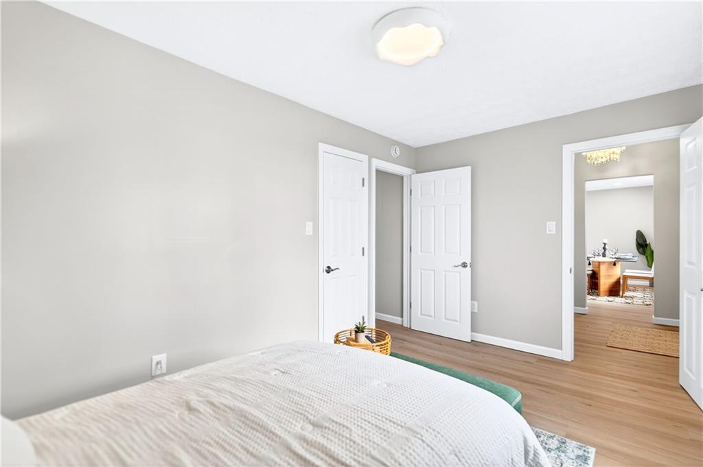 731 Chartiers Street Bridgeville, PA 15017 - Photo 25 of 48 a bedroom with a bed and wooden floor